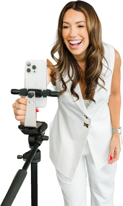 Tracy Harris filming on a tripod